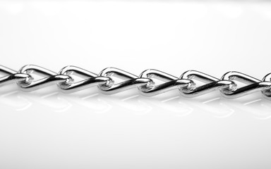 Chain heap - abstract metal background. Collection silver jewelry chains on an isolated black...