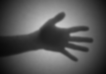 Silhouette behind a transparent paper, blurred