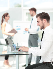Photo of a young business team working in a modern office