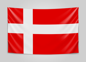 Obraz premium Hanging flag of Denmark. Kingdom of Denmark. National flag concept.