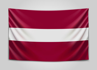 Hanging flag of Latvia. Republic of Latvia. Latvian national flag concept.