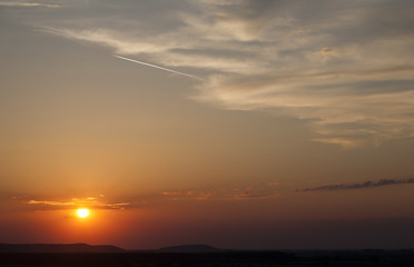 Naklejka premium Beautiful red dawn with mountains. Photographed in the town of Berehove. Ukraine.
