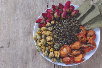 mixture of dried lotus leaf, red rose, hawthorn, cassia seed and chrysanthemum for chinese slimming tea.