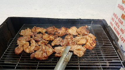 Beef steaks on the grill with flames