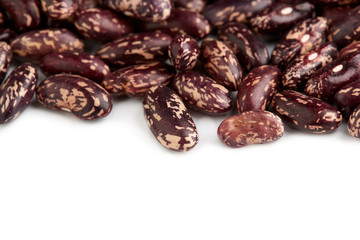 Obraz premium Dark Spotted kidney bean isolated on white background. Dark kidney bean texture background. A large bean with a subtle sweet flavor and soft texture. Beans. Proper nutrition. Vitamins. Healthy food.