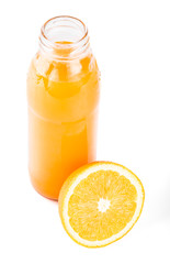 Orange juice. Isolated drink. A glass of orange juice and pieces of orange fruit isolated on white background. Citrus. Diet. Vitamins. Healthy food.