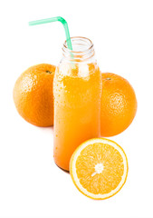 Orange juice. Isolated drink. A glass of orange juice and pieces of orange fruit isolated on white background. Citrus. Diet. Vitamins. Healthy food.