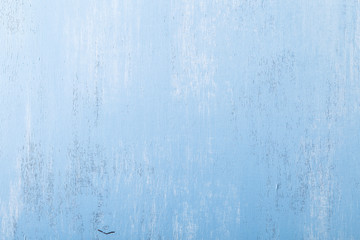 Blue wood background. Painted scraped wooden board. Grunge plywood texture or pattern.