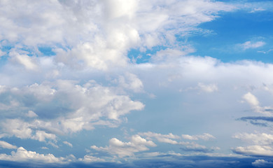 White clouds in the blue sky.