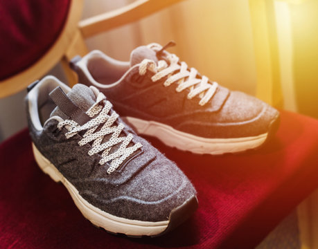 Close up fashion image of female grey sneakers,wool material.Close up running shoes.