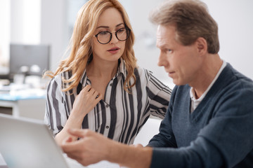 Sexual young secretary seducing mature coworker in the office