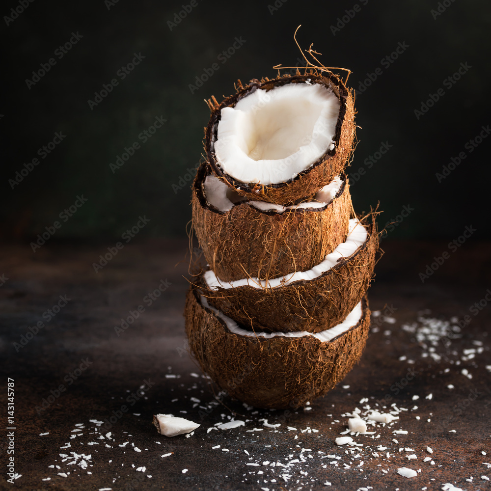 Wall mural stack of coconut half and coconut flakes