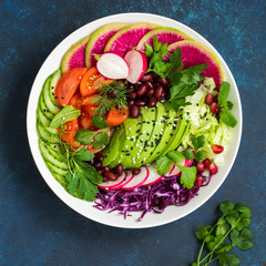 healthy vegan lunch bowl salad.  Avocado, red bean, tomato, cucumber, red cabbage  and watermelon radish