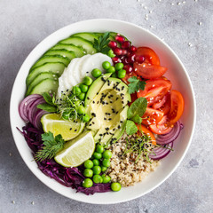 healhty vegan lunch bowl. Avocado, quinoa, tomato, cucumber, red cabbage, green peas and radish  vegetables salad.