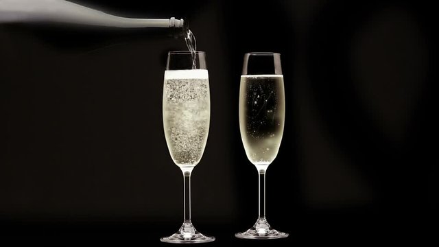 Loopable Cinemagraph Video. Pouring Champagne into flute glass.