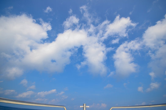 Blue sky in speed boat.