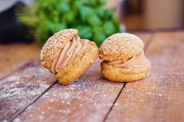 Baked sweet cakes on a wooden table.