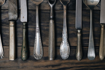 Old cutlery on a wooden table
