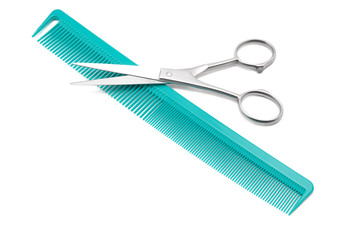 Scissors and hairbrush isolated on white