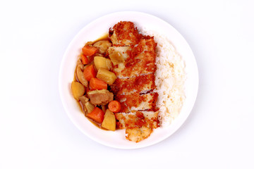 Rice with deep fried dolly fish in japanese yellow curry.