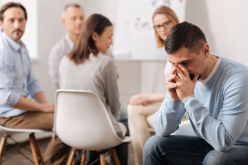 Upset male thinking about his mistakes