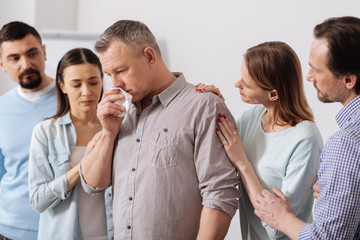 Thoughtful worker keeping serviette in right hand