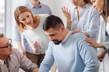 Fototapeta premium Serious office worker looking downwards