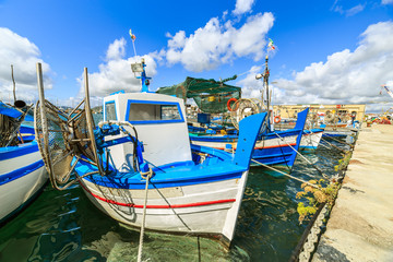Fototapeta na wymiar Boats in a port of Alghero, Sardinia, Italy