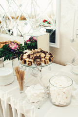 Color zephyrs in glass jar. Wedding candy bar