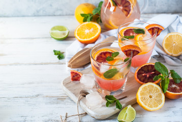 Homemade lemonade and ingredients. Citrus cold summer drink.