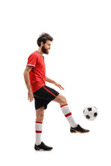 Bearded guy in a red jersey juggling a football