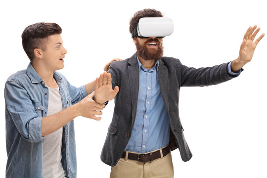 Son showing his father how to use a VR headset