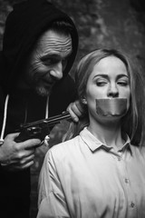 Crazy evil abductor demanding victims obedience