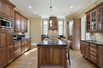 Kitchen with black granite island top