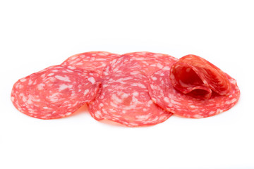 Salami smoked sausage slices isolated on white background cutout.