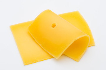 Cheese slices on white background cutout.