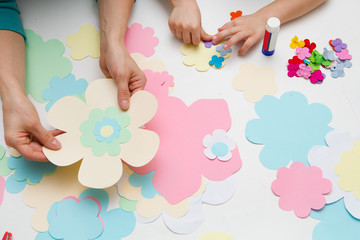 Obraz na płótnie Canvas mother and the child prepare together Paper decor. children's creativity. Tools and materials for children's art creativity on table. Mother's day or March 8 greeting card DIY idea