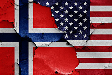 flags of Norway and USA painted on cracked wall