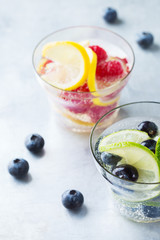 Lemon lime berries fresh infused water detox drink cocktail lemonade