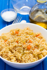 couscous with vegetables in white bowl