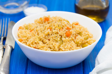 couscous with vegetables in white bowl