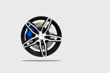 Close up of a modern sport wheel with brake disk and caliper pad. isolated background and clipping path.