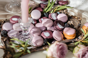 Traditional French desserts on a table in interior