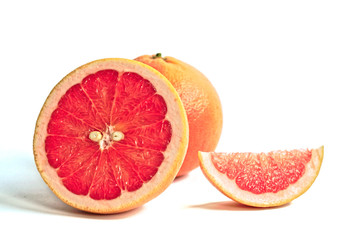 Closeup of red grapefruits on a white background