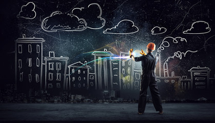 Builder man using media interface . Mixed media