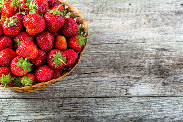 Fresh strawberries in the basket, fruits on farmer market table