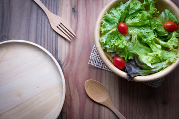 bowl of salad on wodden table