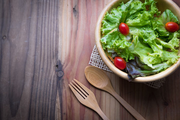 bowl of salad on wodden table