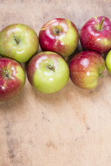 tasty apples on a wooden background
