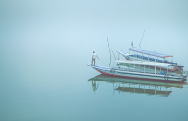 Floating fishing boat in the sea